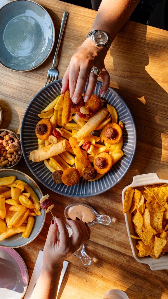 A mouthwatering snack platter with fries and dipping sauces, perfect for sharing.