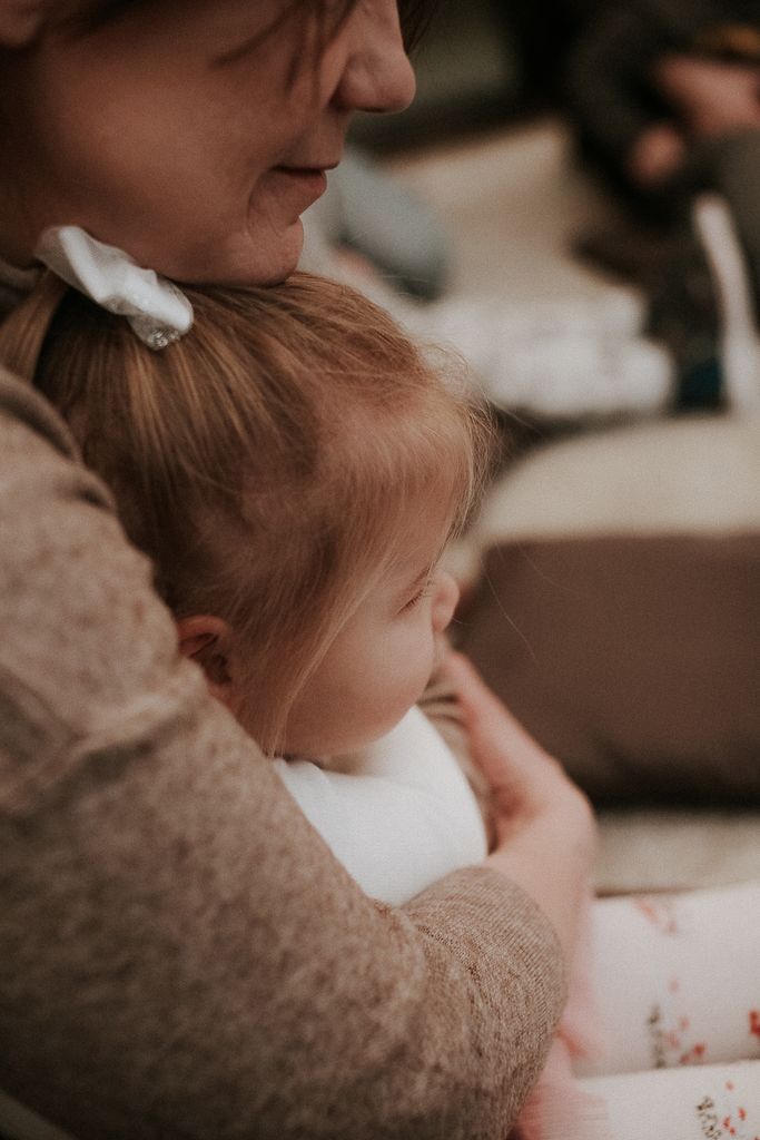 A tender moment captured between a mother and her daughter, emphasizing love and bonding.